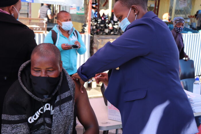Nurse administers COVID-19 vaccine to man in Lesotho