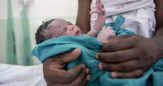 newborn baby held by mother in Eswatini