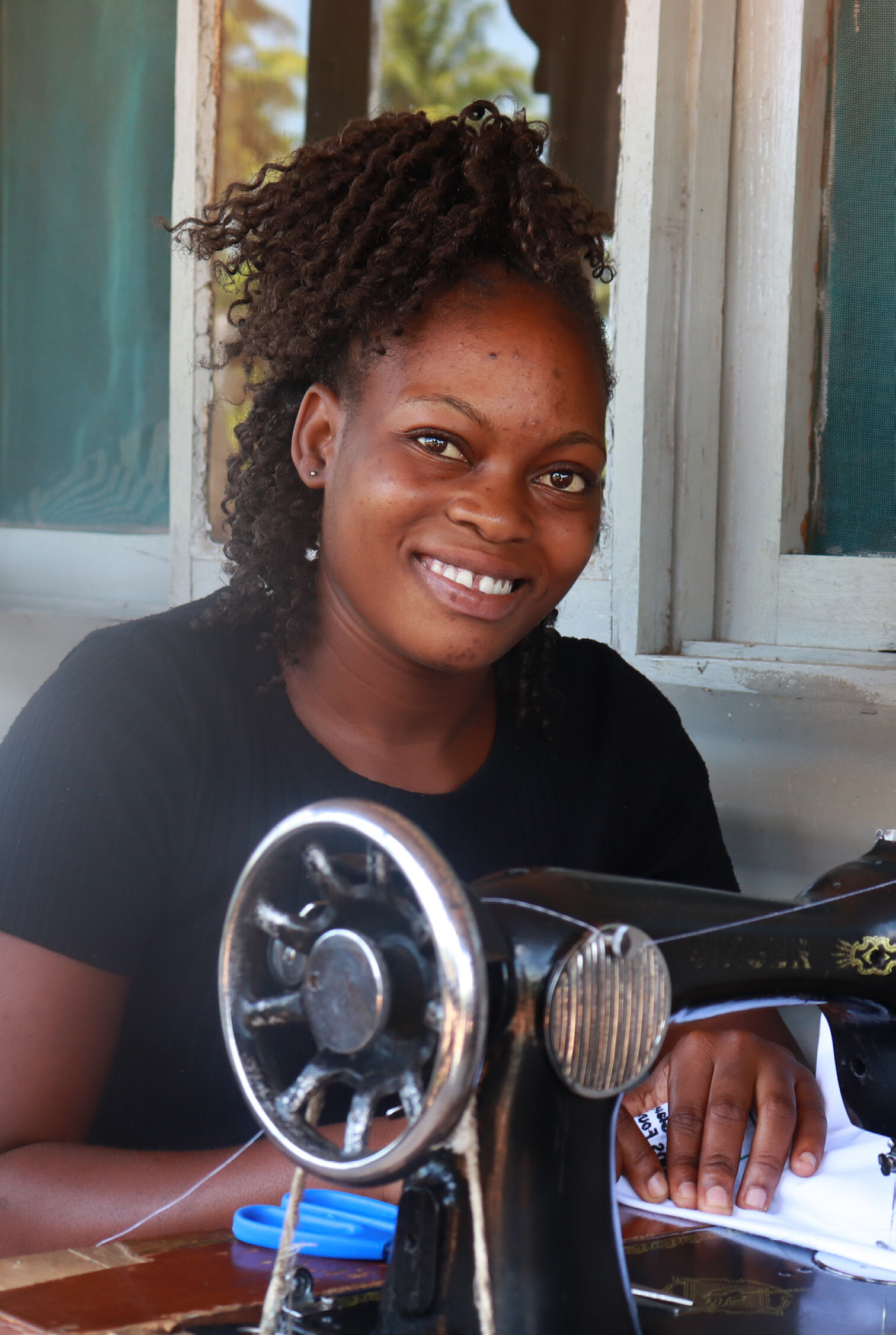 Veronica with Sewing Machine Elizabeth Glaser Pediatric AIDS Foundation